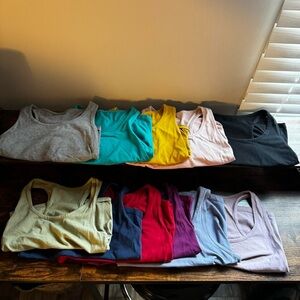 Bundle of ELEVEN (11) racer back cropped tank tops in size medium